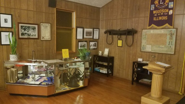 Village Hall display area with historical exhibits and framed photos