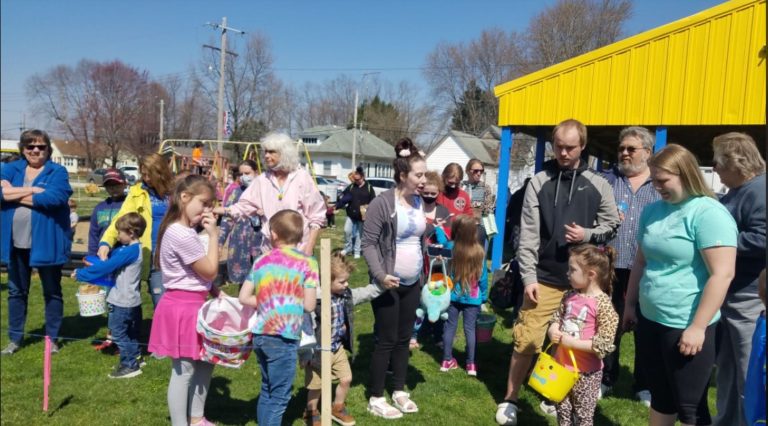 Families gathered near the pavilion at the Easter egg hunt