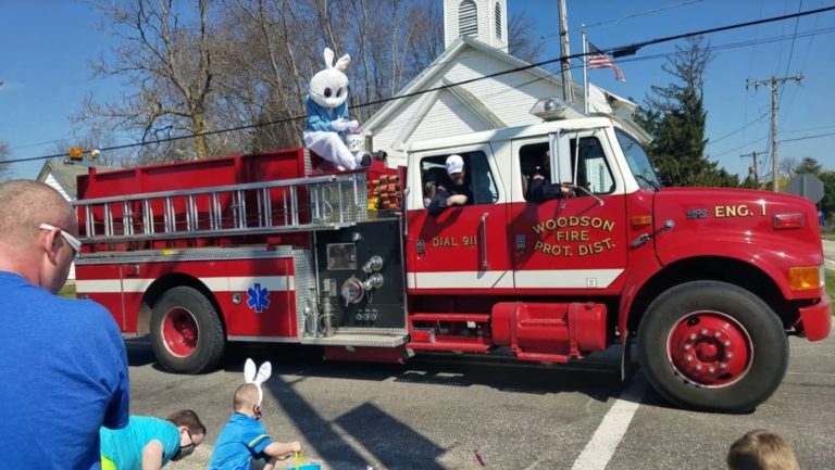 Easter Bunny riding on a Woodson fire engine