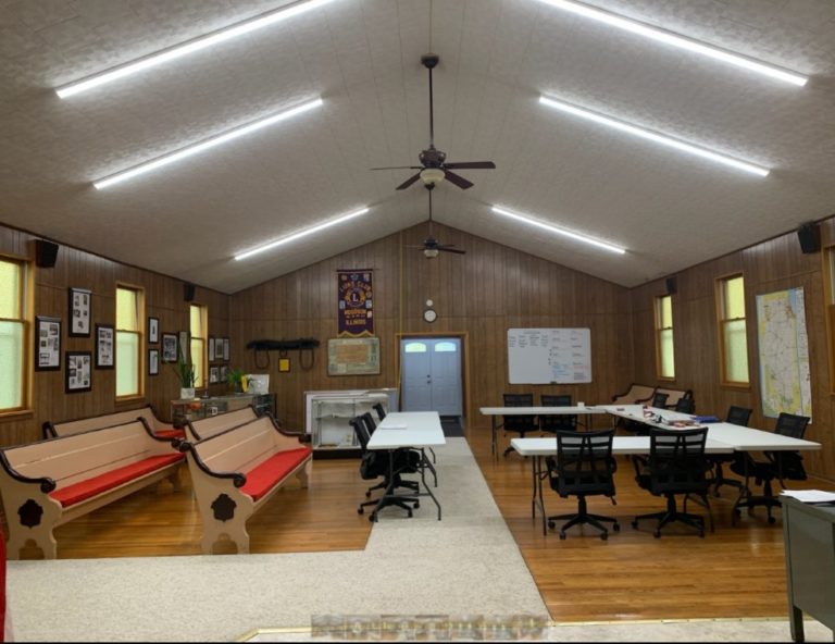 Village Hall meeting room with tables and benches