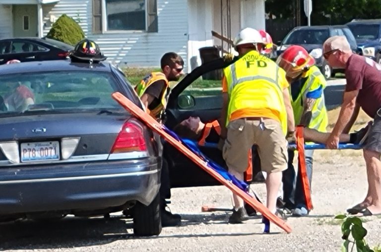 Firefighters and EMTs practicing a vehicle rescue