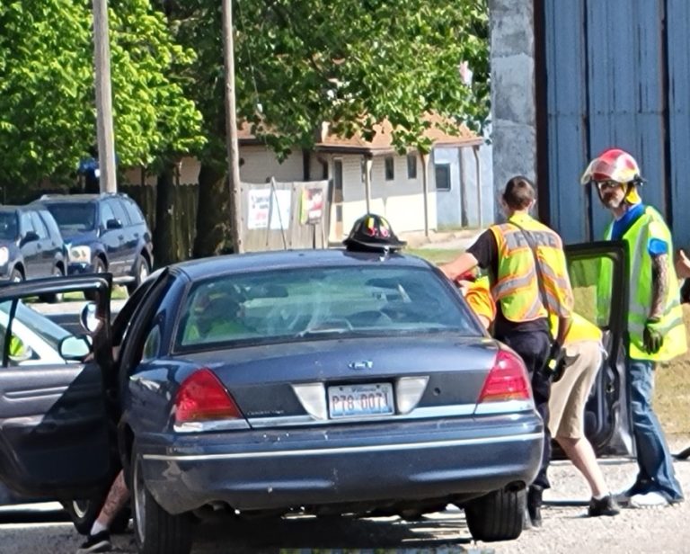 Firefighters working at a car during a rescue drill
