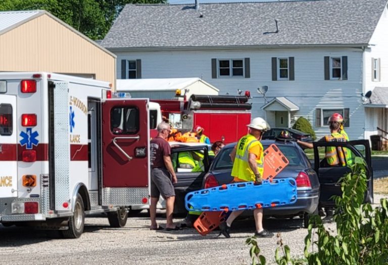 Rescue crews carrying a backboard during a vehicle rescue drill