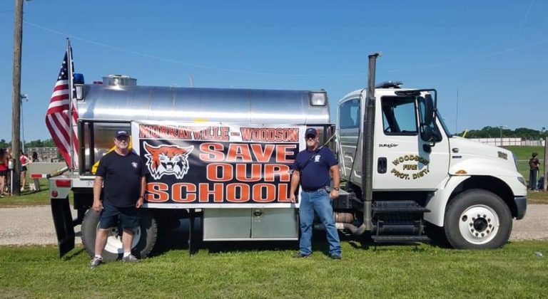 Water tanker truck decorated for the Save Our School parade