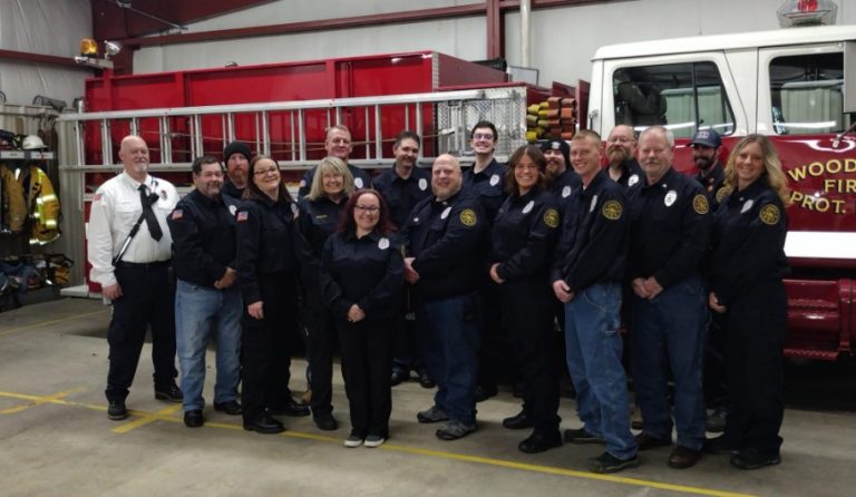 Woodson Fire Protection District members in front of a fire engine, 2022