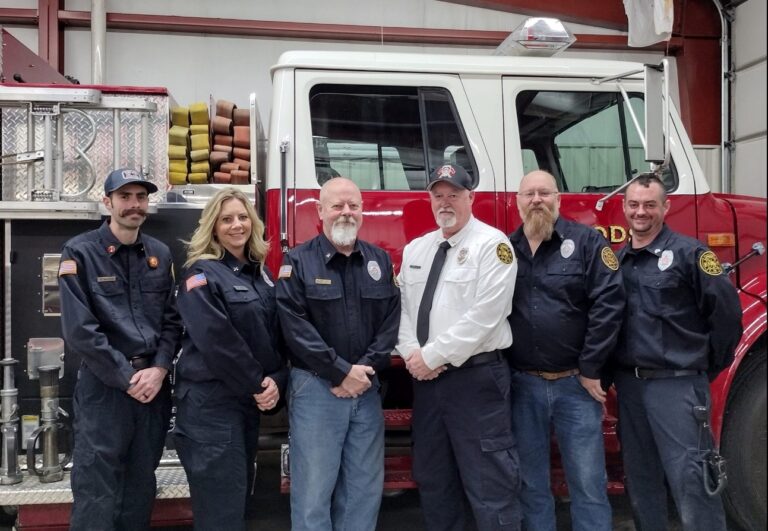 Woodson Fire Protection District members in front of a fire engine