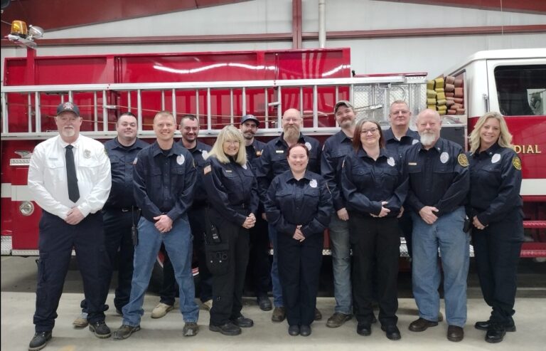 Woodson Fire Protection District members in front of a fire engine