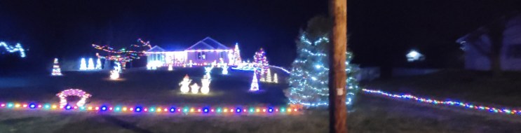 Home decorated with holiday lights at night