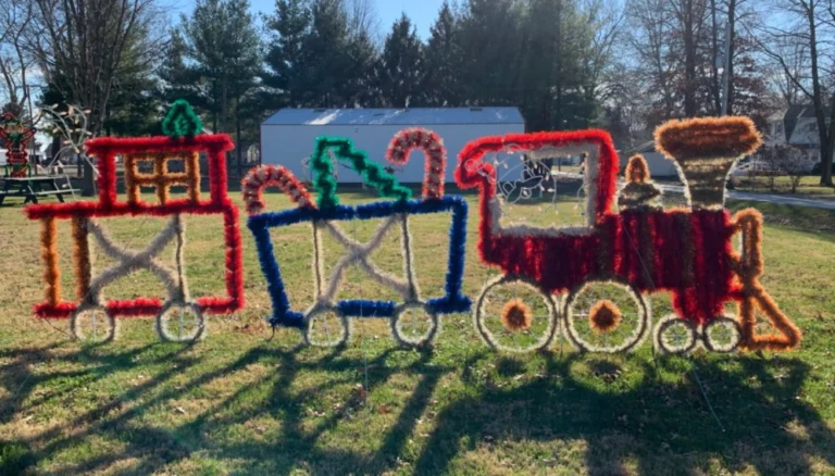 Holiday train decoration made of tinsel in the park
